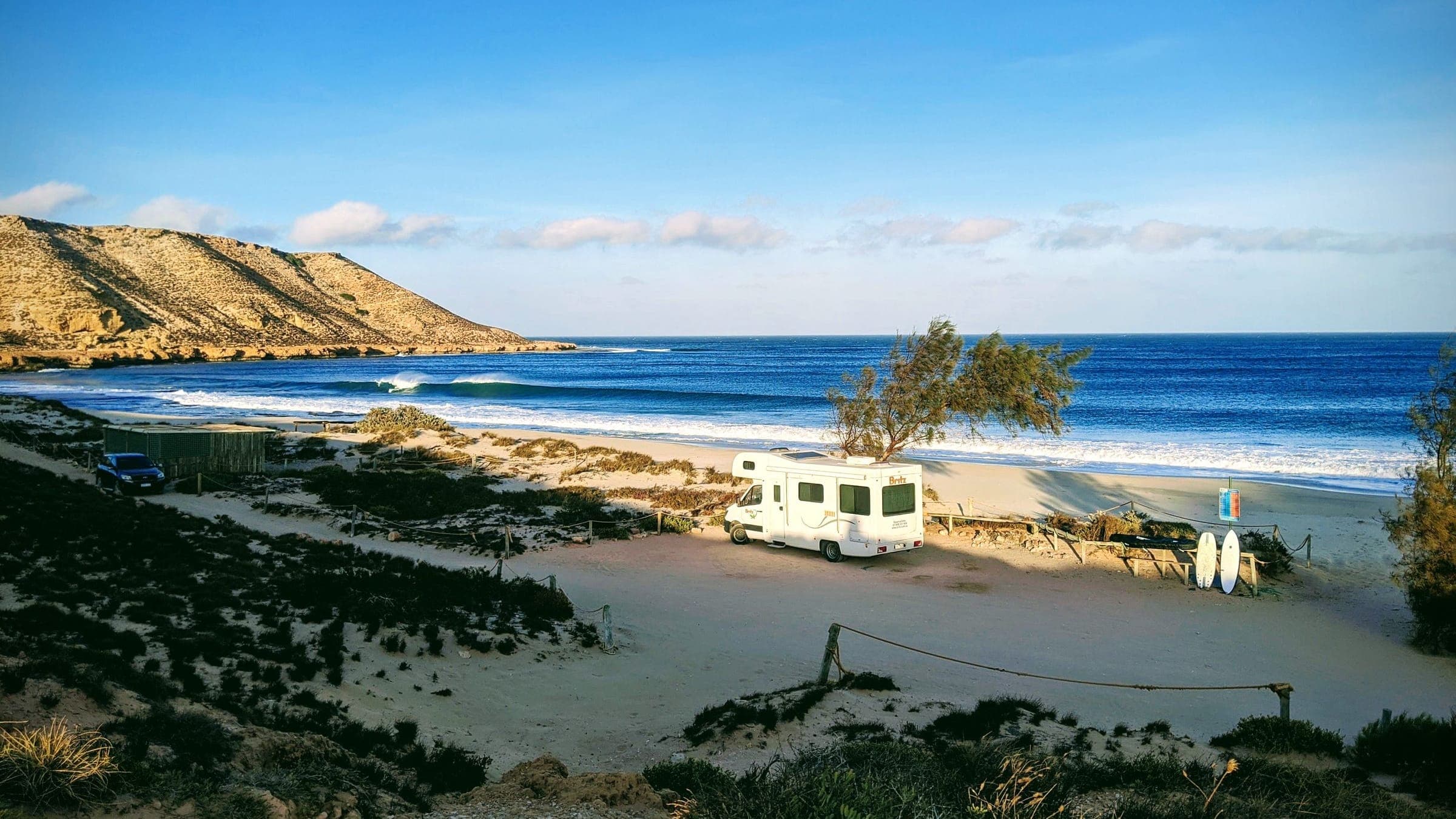A caravan at a beachside campsite in Western Australia on a sunny day